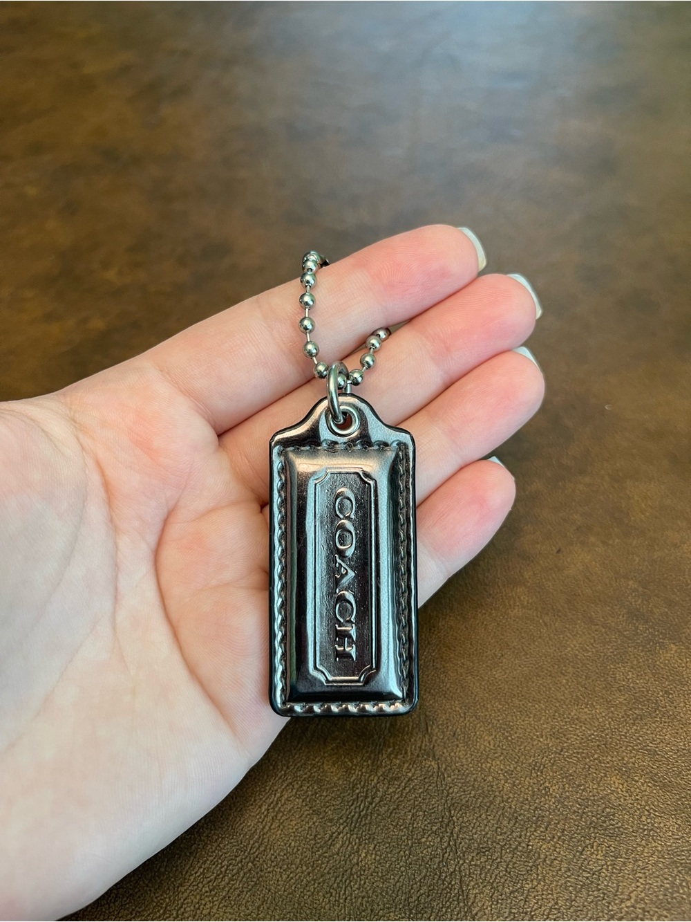 Coach silvery hangtag
